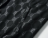 Giacca da tuta nera con monogramma GG e strisce Web distintive