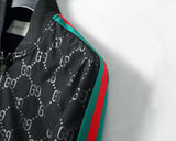 Giacca da tuta nera con monogramma GG e strisce Web distintive 